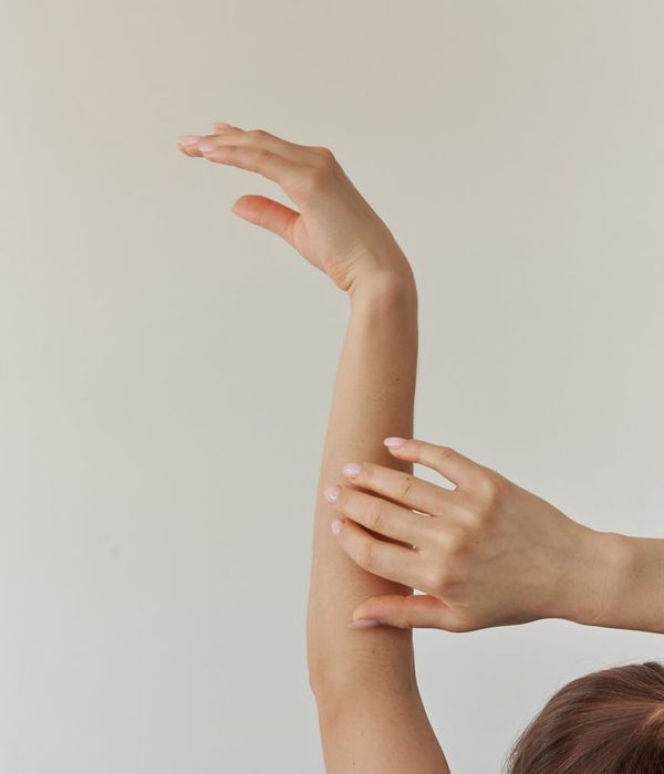 Woman in a graceful yoga pose with topaz light accents.